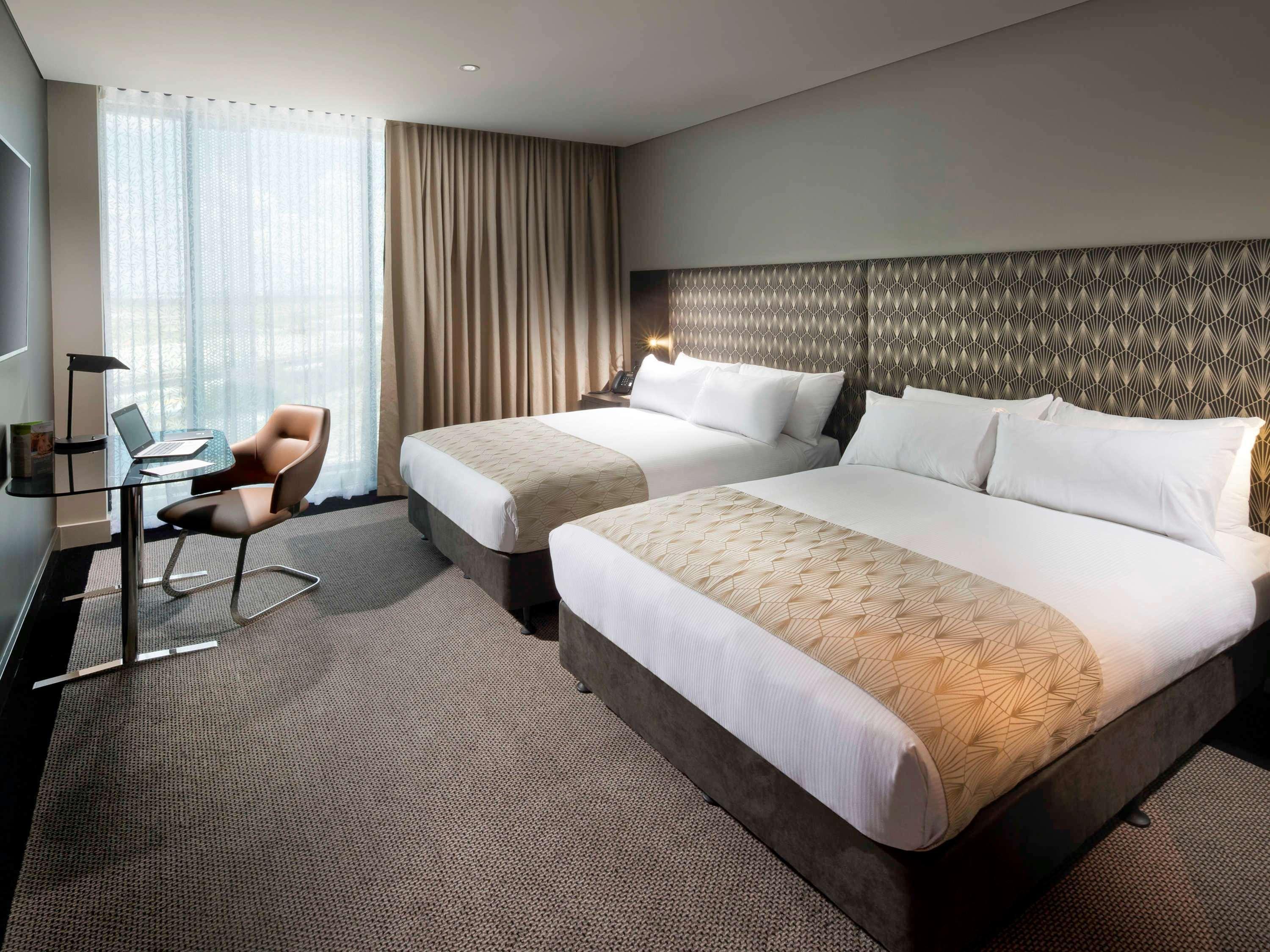 Отель Pullman Brisbane Airport Экстерьер фото A room at the hotel